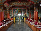 
Pokhara Karma Dubgyu Chokhorling Monastery - Monks In The Main Prayer Hall With Gilded Shakyamuni Buddha Statue
